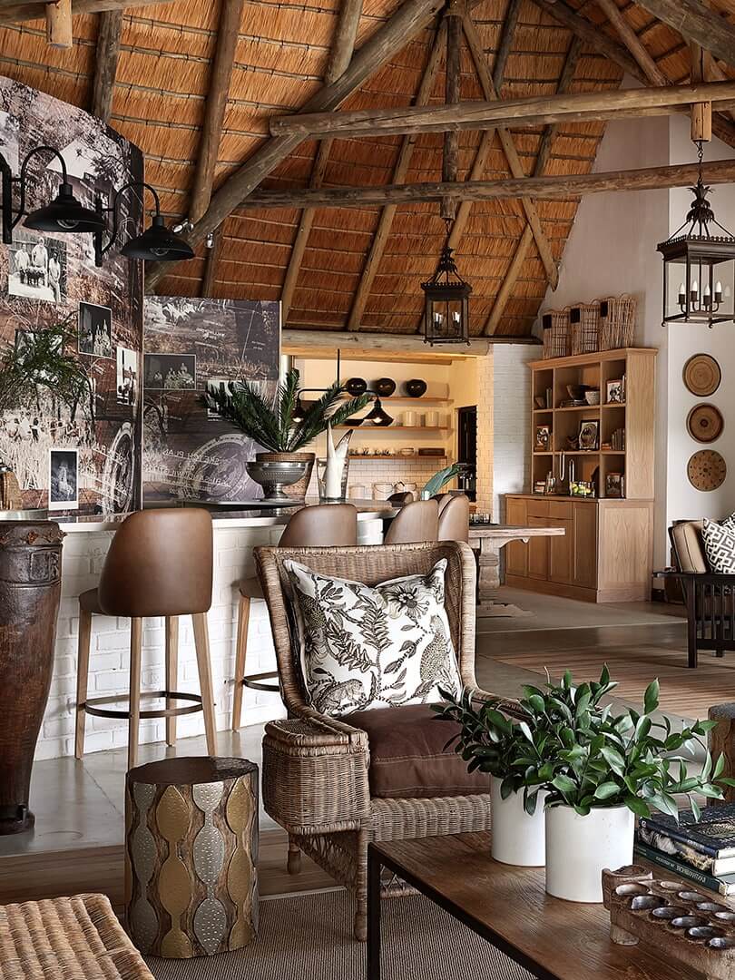 Guest living area with comfortable armchairs and bar, Londolozi Private Game Reserve. Photo by Elsa Young. Guest living area with comfortable armchairs and bar, Londolozi Private Game Reserve. Photo by Elsa Young.