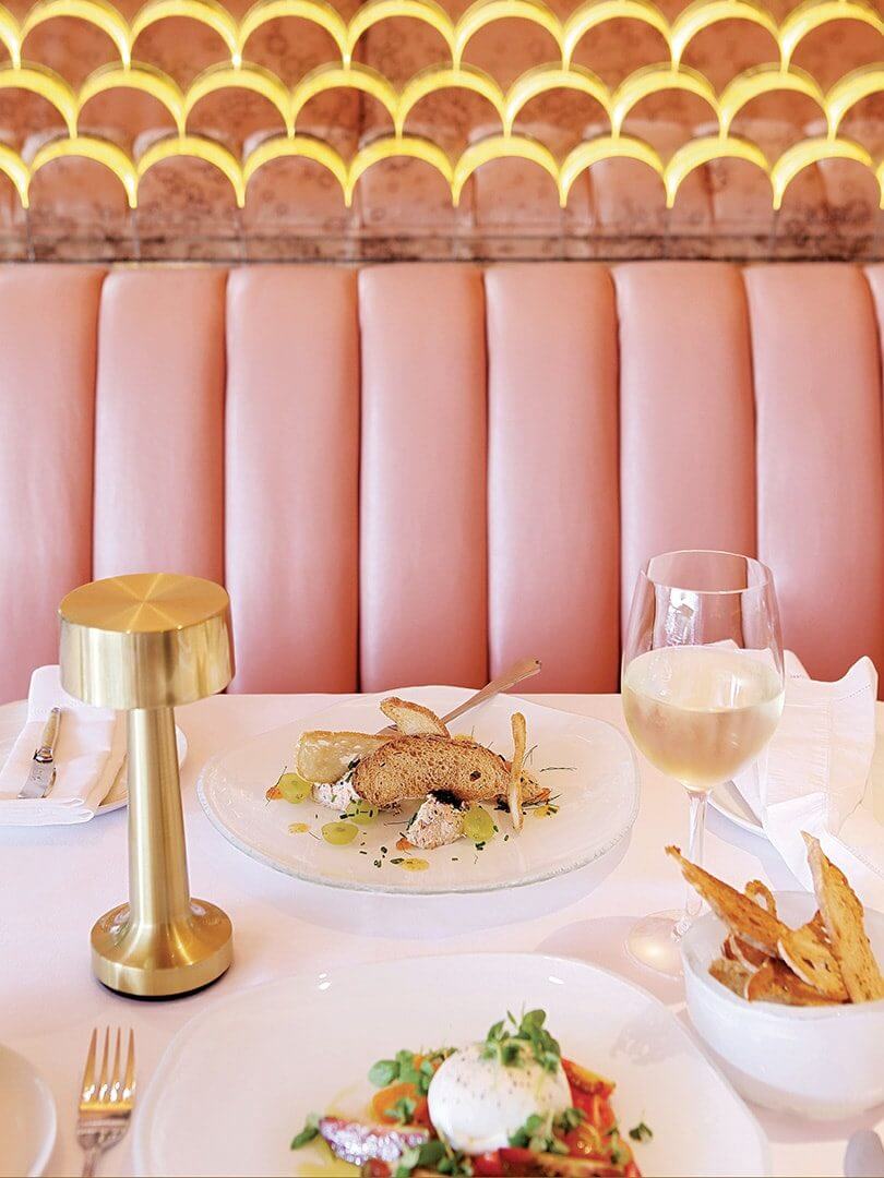 A colourfully bright upholstered banquette at Tashas Restaurant. Elsa Young Photography. A colourfully bright upholstered banquette at Tashas Restaurant. Elsa Young Photography.