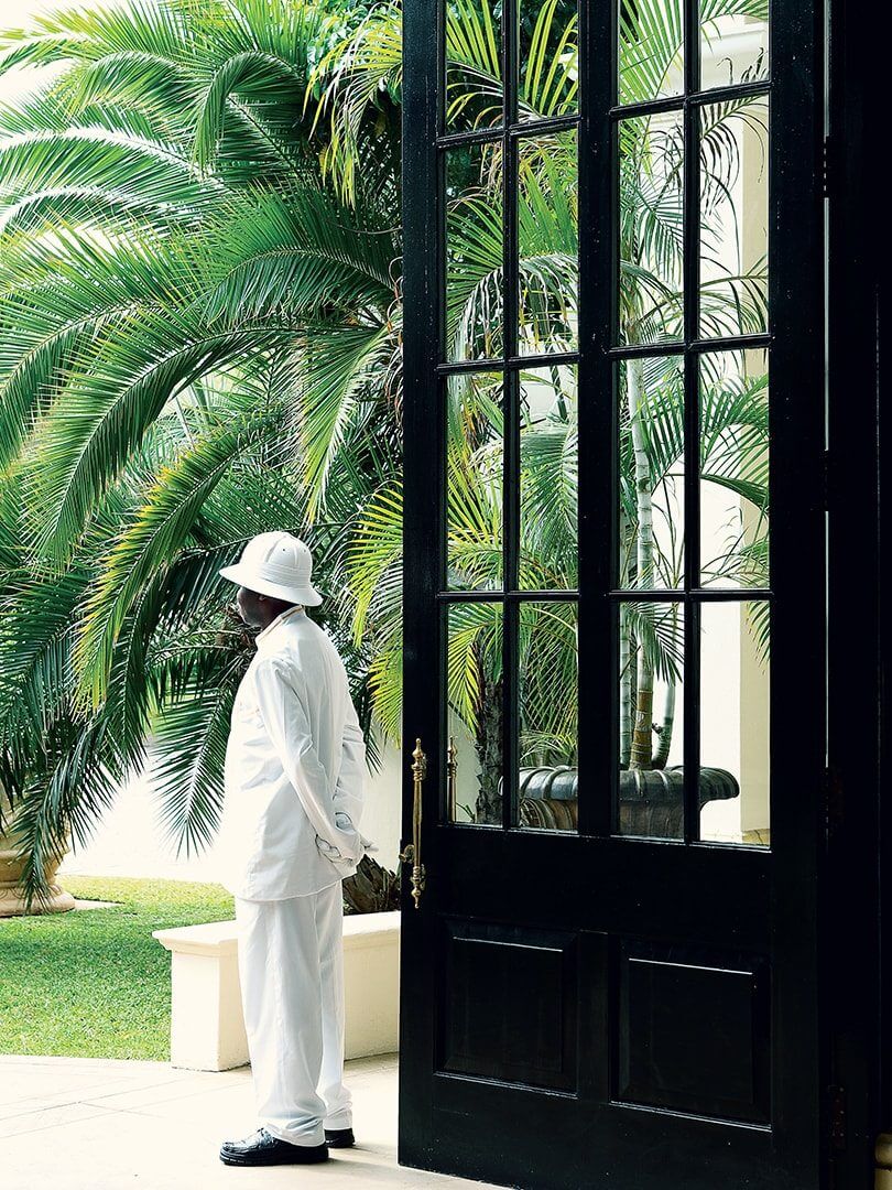Porter standing outside the Royal Livingstone hotel. Photo by Elsa Young. Porter standing outside the Royal Livingstone hotel. Photo by Elsa Young.