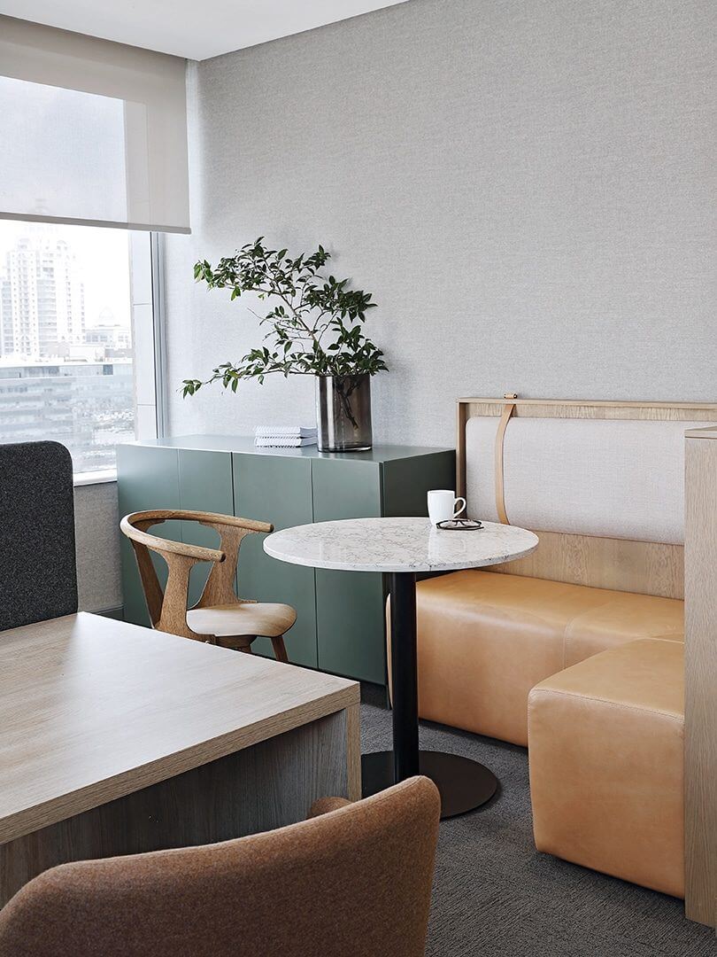 Relaxed, earth-toned office with city views. Photograph by Elsa Young. Relaxed, earth-toned office with city views. Photograph by Elsa Young.