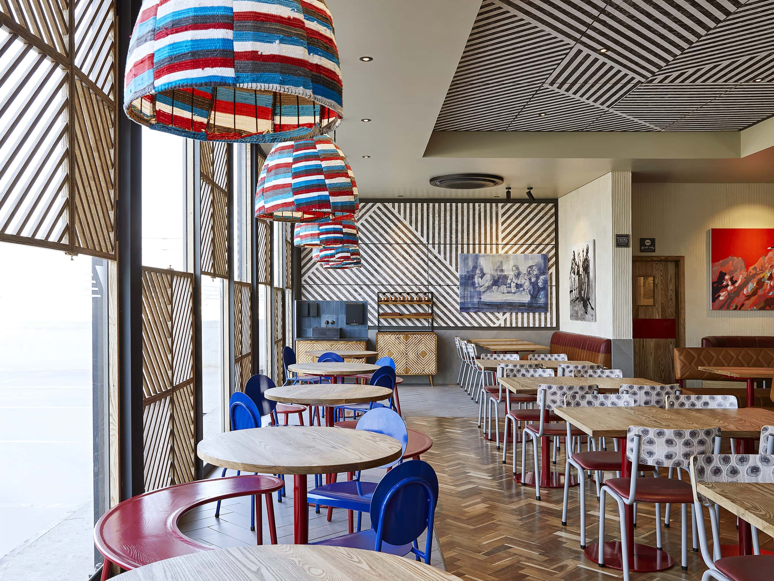 A colourful Nando's interior. Elsa Young Photography. A colourful Nando's interior. Elsa Young Photography.