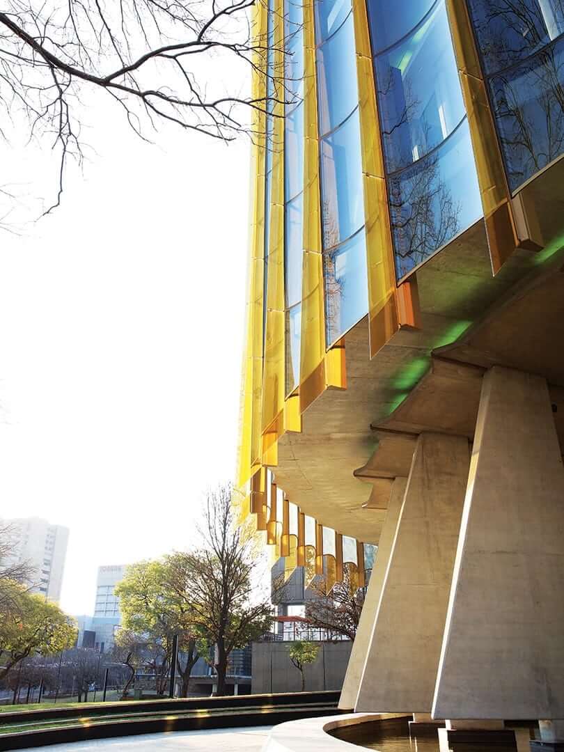Beautiful, bright scalloped building exterior. Photograph by Elsa Young. Beautiful, bright scalloped building exterior. Photograph by Elsa Young.