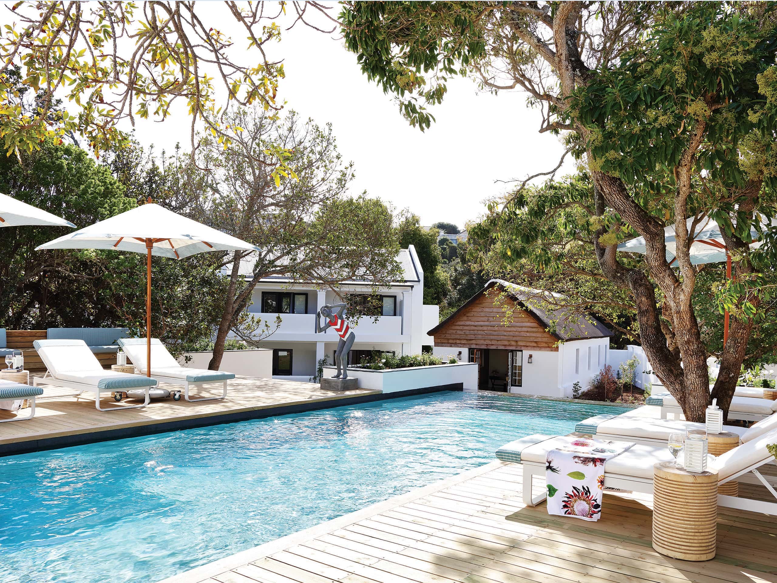 Loungers on a wooden deck surrounding a swimming pool at the Old Rectory. Loungers on a wooden deck surrounding a swimming pool at the Old Rectory.