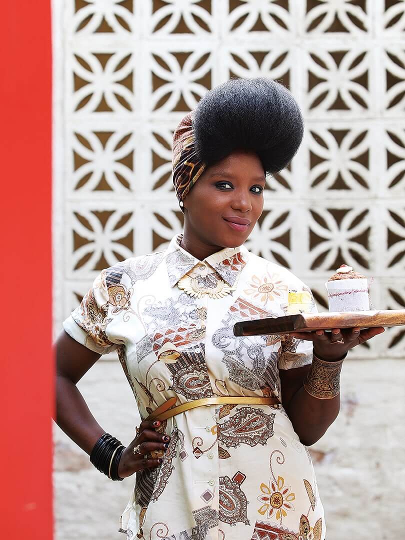A magnificent waitress holding a board of food at The Freedom Cafe. Photograph by Elsa Young. A magnificent waitress holding a board of food at The Freedom Cafe. Photograph by Elsa Young.