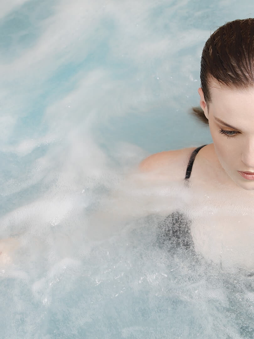 Woman floating in a spa pool at the Saxon Spa, Johannesburg. Woman floating in a spa pool at the Saxon Spa, Johannesburg.