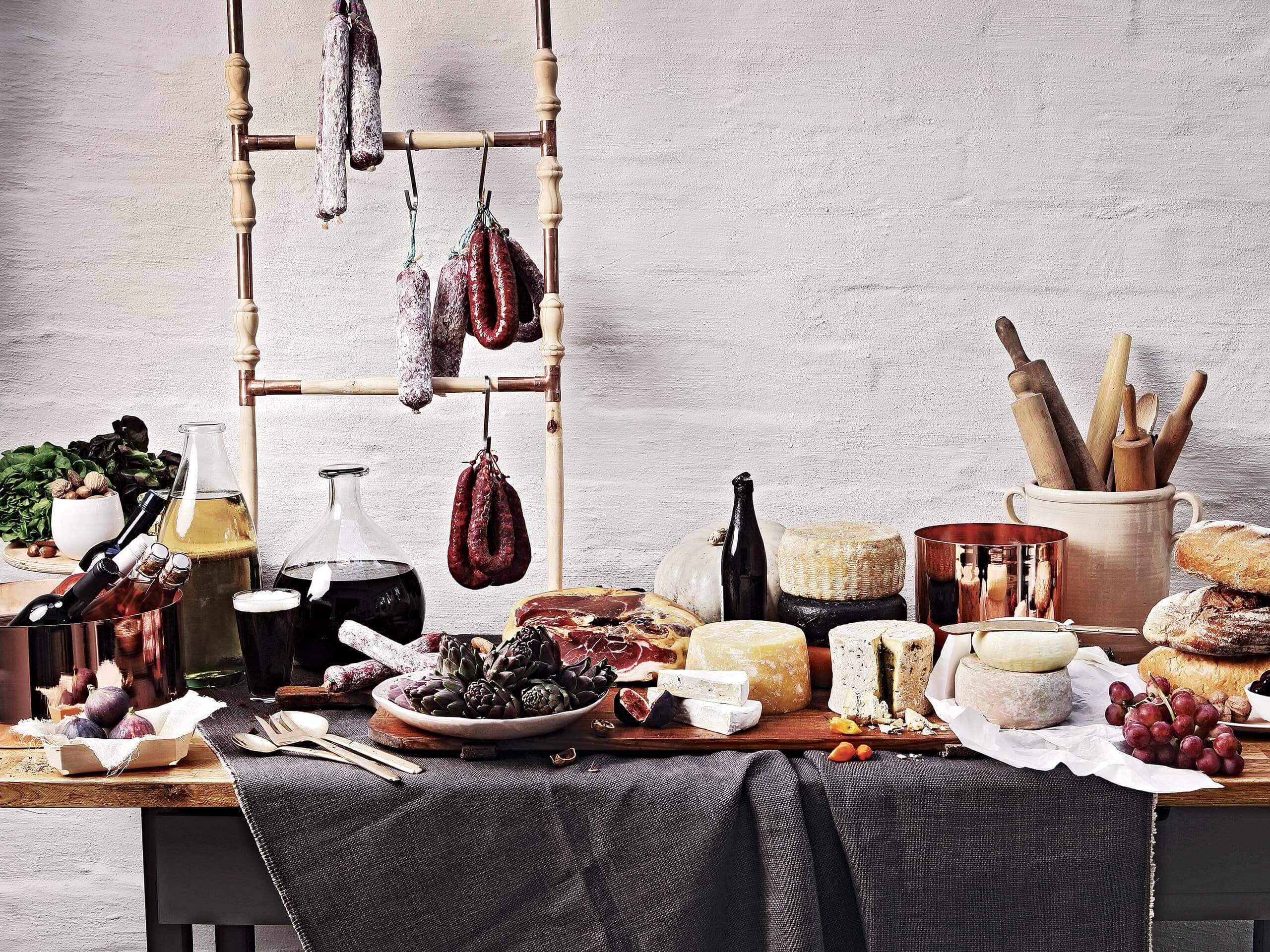 A delectable spread of wines, oils, cheeses, meats, fruits and breads. Elsa Young Photography. A delectable spread of wines, oils, cheeses, meats, fruits and breads. Elsa Young Photography.