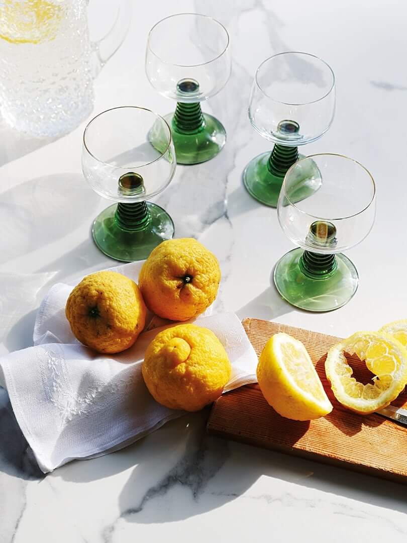 Lemons being cut in preparation for cockails. Elsa Young Photography. Lemons being cut in preparation for cockails. Elsa Young Photography.